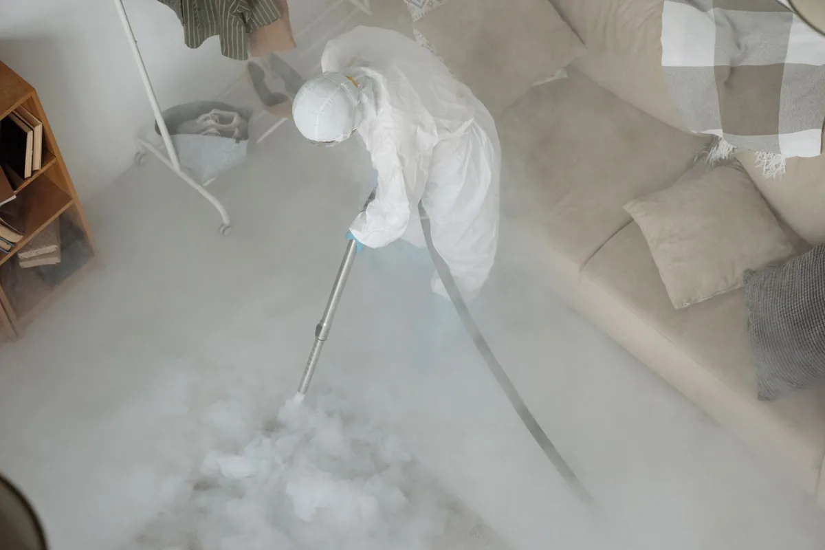 Biohazard cleanup technician in protective equipment, Oliver Springs, TN